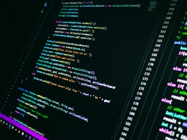 Close-up of colorful programming code on a computer screen, showcasing digital technology.